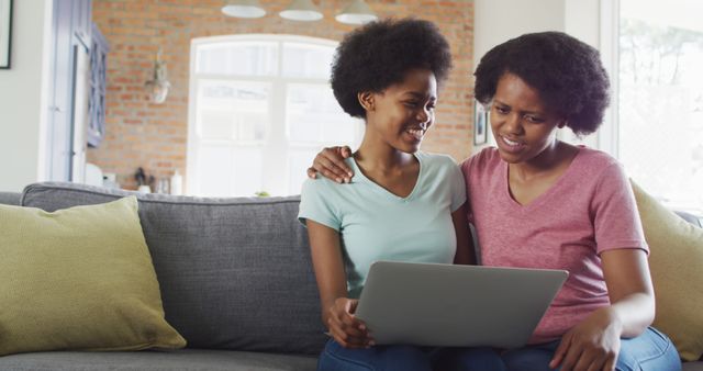 Mother and Daughter Using Laptop Together on Cozy Couch - Download Free Stock Images Pikwizard.com