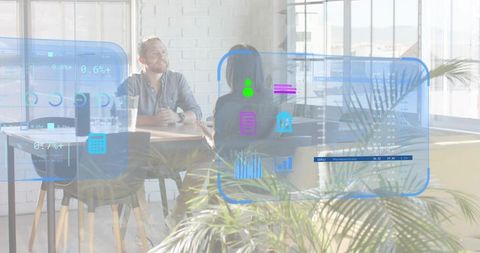 Business professionals discussing with holographic data overlays in modern office space