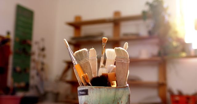 Artist Paintbrushes in a Creative Studio with Shelf and Light - Download Free Stock Images Pikwizard.com