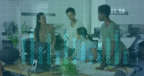 Diverse businesswomen collaborating in technology focused office