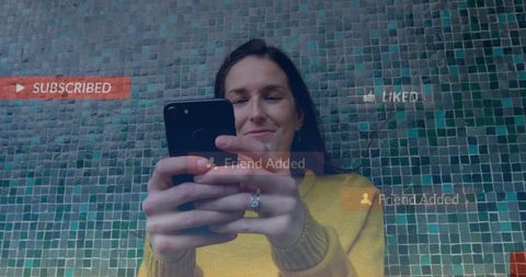 Smiling Woman Engaged with Social Media Interactions on Smartphone