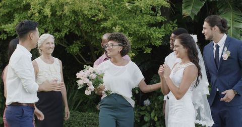 Outdoor Wedding Celebration with Bouquet Toss Tradition