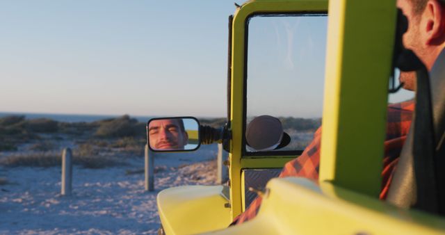 Man Driving Yellow Jeep with Scenic Beach View - Download Free Stock Images Pikwizard.com