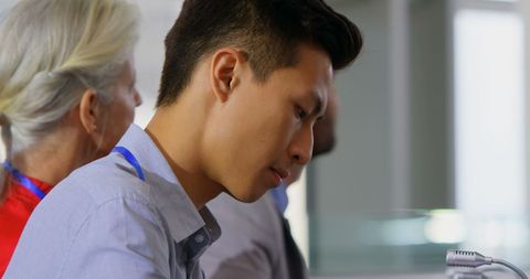 Attentive participants at business seminar taking notes