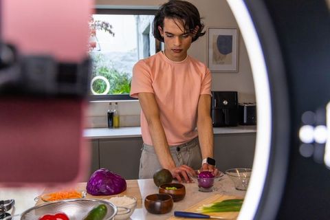 Content Creator Preparing Colorful Veggie Bowl with Purple Cabbage and Avocado