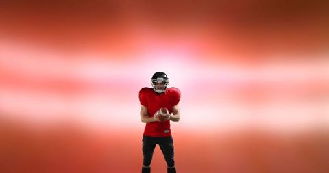American Football Player Posing with Ball on Vivid Background
