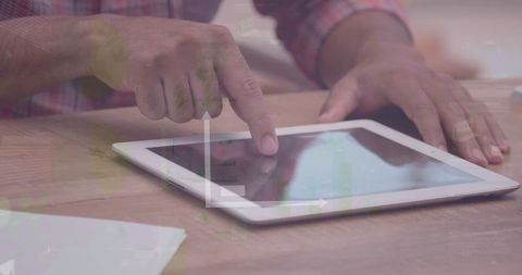 Man Analyzing Financial Data on Tablet with Digital Graph Overlay