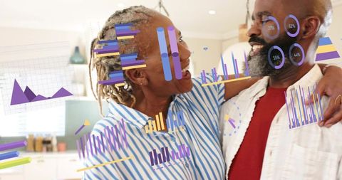 Mature couple embracing in kitchen with colorful data visualizations and charts
