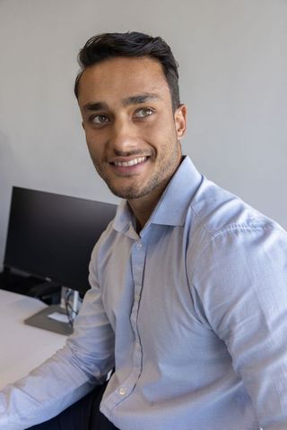 Business Professional Working on Keyboard at Minimalist Workspace