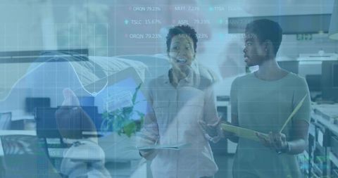 Professionals Analyzing Digital Data in Modern Office Environment