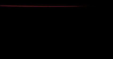 Dynamic red neon light trails on black background