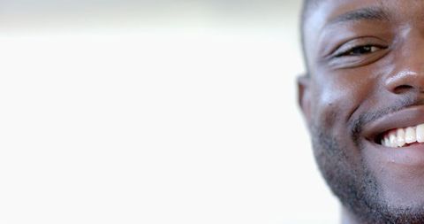 Close-Up of African American Man Smiling with White Background