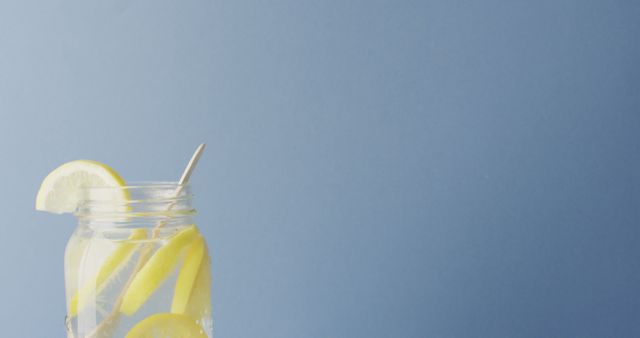 Image of jar with lemonade and straw on blue background - Download Free Stock Photos Pikwizard.com