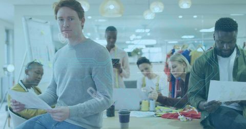 Diverse office team collaborating in modern workplace