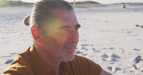 Senior Man Relaxing at the Sunny Beach