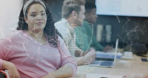 Working woman with cybersecurity technology in office meeting