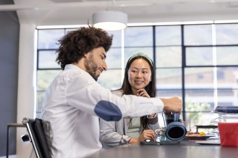 Coworkers Enjoying Coffee Collaboration in Modern Office Setting