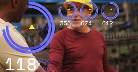 Shaking hands on factory floor with ar hud overlays for industrial teamwork