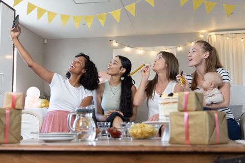 Diverse Friends Celebrating with Selfie at Home Party