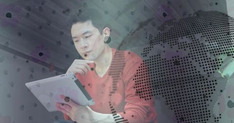 Man Analyzing Data on Tablet with Global Map Overlay