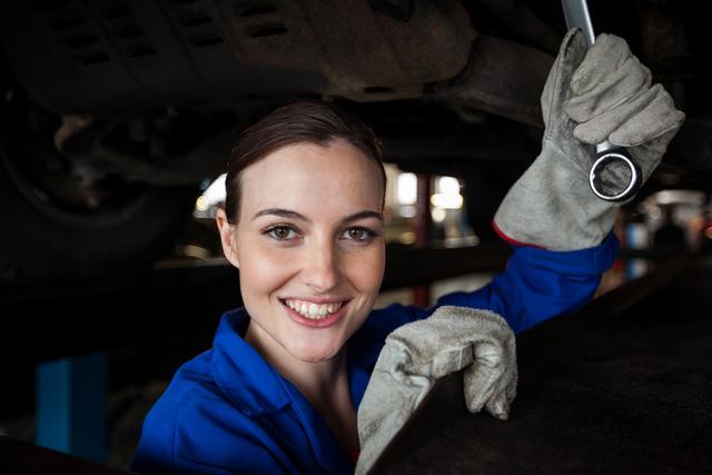 Female mechanic servicing a car - Download Free Stock Photos Pikwizard.com