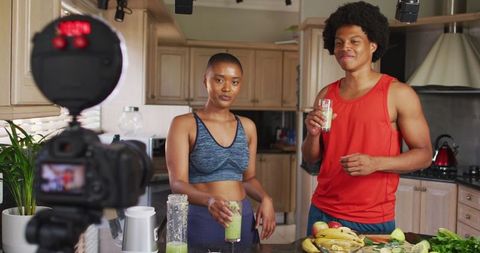 Healthy lifestyle influencers creating smoothie preparation video