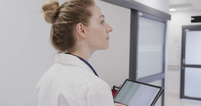 Female Doctor Using Digital Tablet in Clinic Corridor - Download Free Stock Images Pikwizard.com