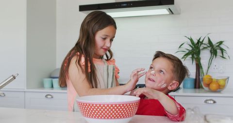 Siblings Bonding in Kitchen While Baking Together