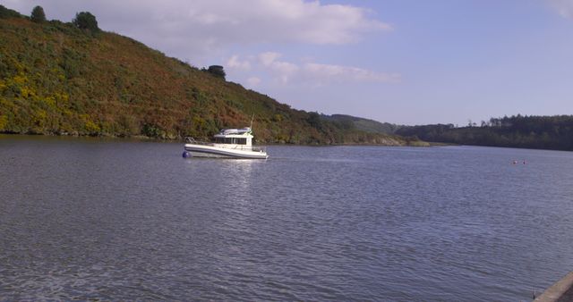 Scenic River Landscape with Motorboat Under Clear Sky - Download Free Stock Photos Pikwizard.com