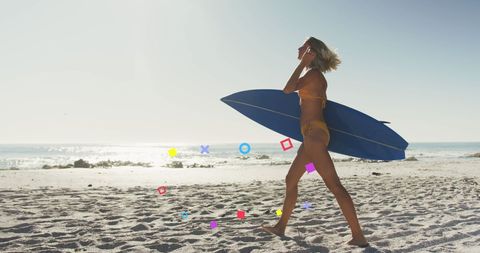 Surfer Woman Walking on Sunny Beach