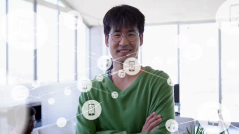 Asian Businessman Working in Networked Office