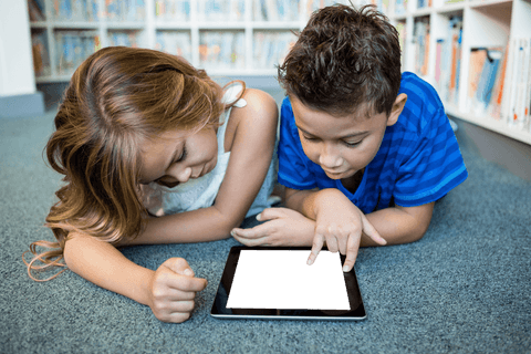 children engaged with transparent tablet screen in library - Download Free Stock Videos Pikwizard.com