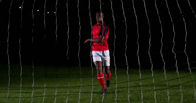 Soccer Player Celebrating Victory at night on Field - Download Free Stock Images Pikwizard.com