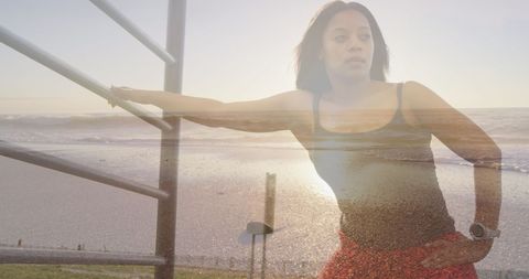 Person with Artificial Leg Meditating at Beach Sunrise