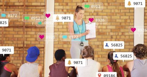 Coach Leading Gym Class with Social Media Engagement