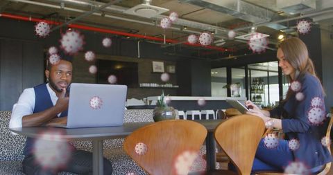 Colleagues In Office with Virus Graphics