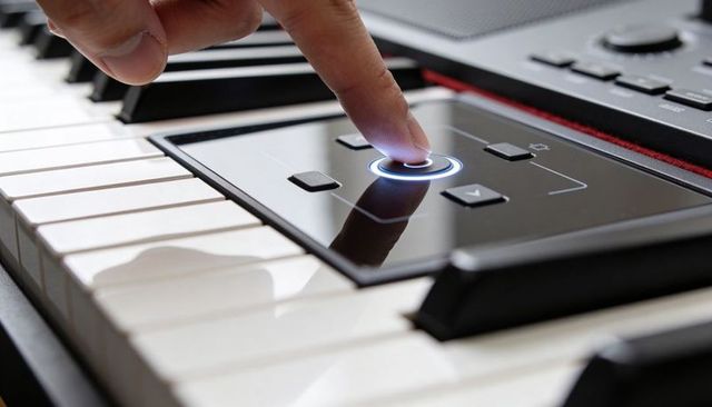 Fingertip activating illuminated touch control on digital piano keyboard for music production