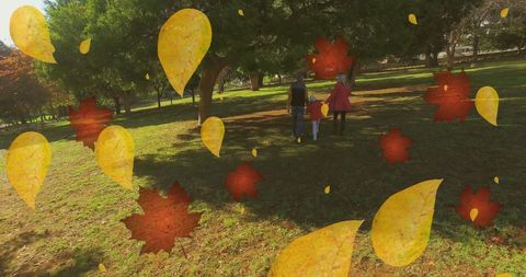 Family Enjoying Park Walk During Fall with Vibrant Leaves