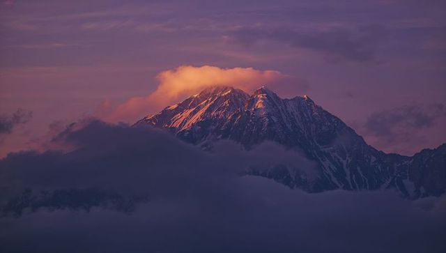Alpine Peak in Sunset Radiance with Mystical Cloud Layers