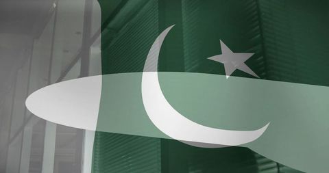 Stylized pakistan flag overlaid on modern office interior