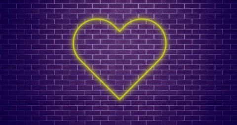 Yellow Neon Heart on Purple Brick Wall
