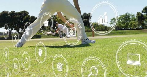 Diving cricketer wearing white kit and helmet with digital icons