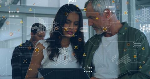 Colleagues Collaborating with Futuristic HUD Interface at Office