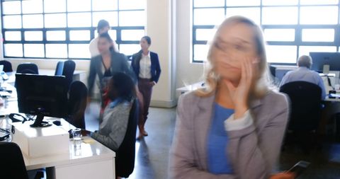 Busy Office with Businesswoman on Mobile Phone in Motion - Download Free Stock Images Pikwizard.com