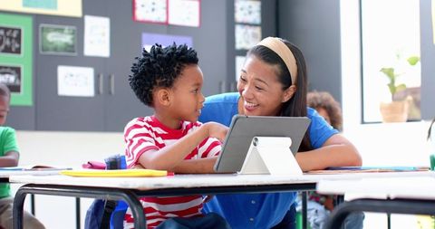 Teacher and Student Using Tablet in Classroom Setting - Download Free Stock Images Pikwizard.com