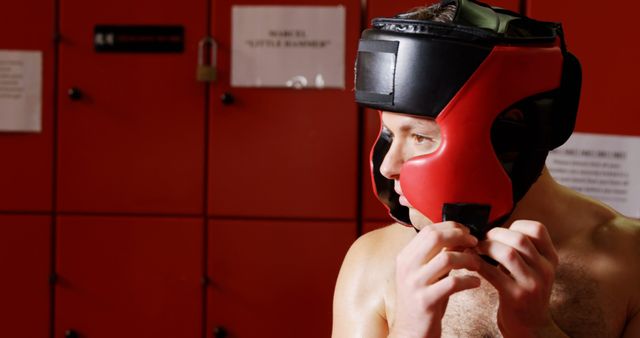 Boxer Adjusting Headgear in Locker Room - Download Free Stock Images Pikwizard.com