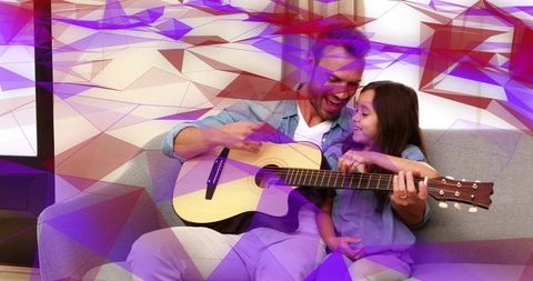 Father Teaching Daughter Guitar on Sofa with Abstract Overlay