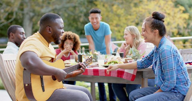 Diverse Group of Friends Enjoying Outdoor Gathering with Guitar - Download Free Stock Images Pikwizard.com