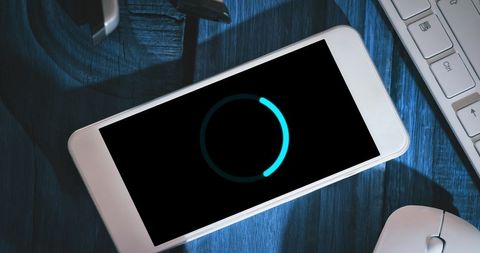 Smartphone Loading Screen in Modern Office - Download Free Stock Images Pikwizard.com