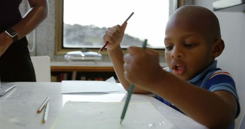 Young Boy Drawing in Home Environment